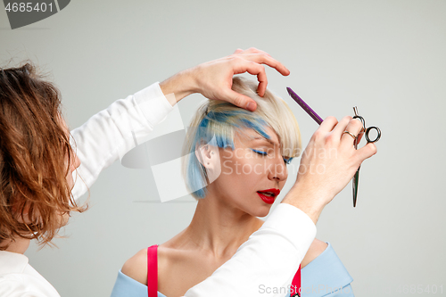 Image of Picture showing adult woman at the hair salon