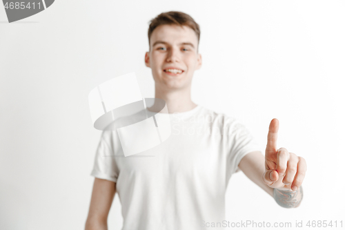 Image of Businessman hand touching empty virtual screen