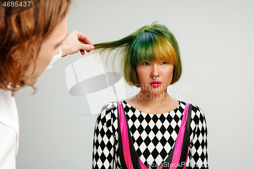 Image of Picture showing adult woman at the hair salon