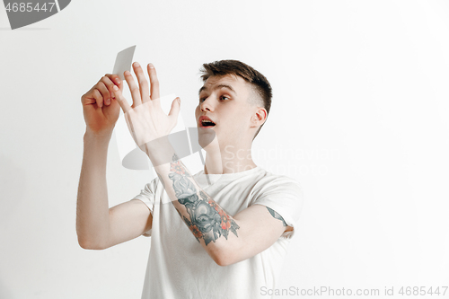 Image of Young man with a surprised expression won a bet