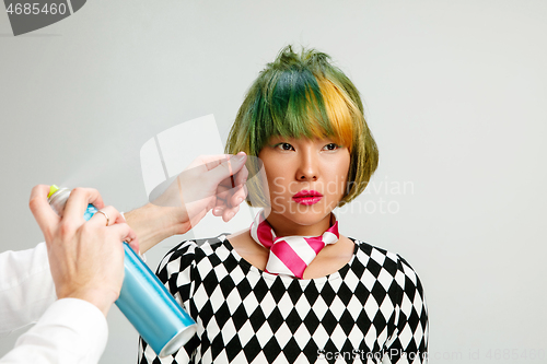 Image of Picture showing adult woman at the hair salon