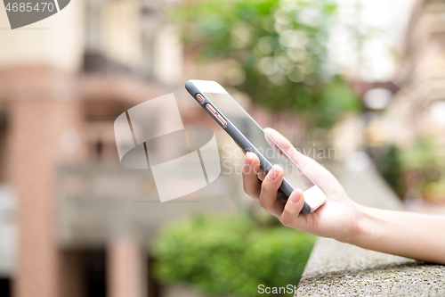 Image of Woman hold with cellphone