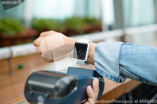 Image of Customer using wearable watch to pay