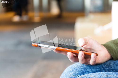 Image of Woman sending text message on smart phone
