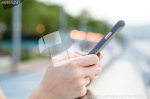 Image of Woman use of mobile phone