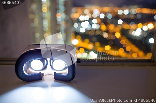 Image of VR device with cityscape background