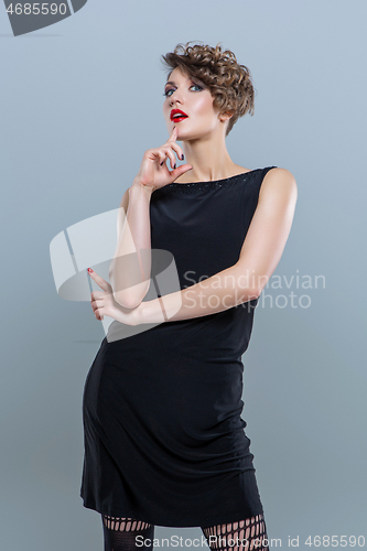 Image of girl in small black dress