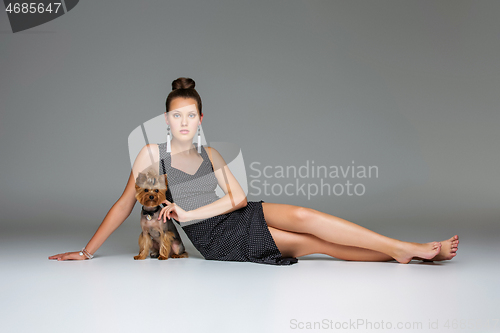 Image of Girl with yorkie dog