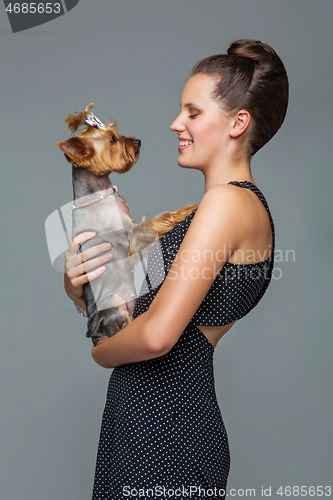 Image of Girl with yorkie dog