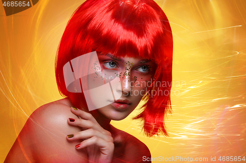 Image of Beautiful girl in red wig