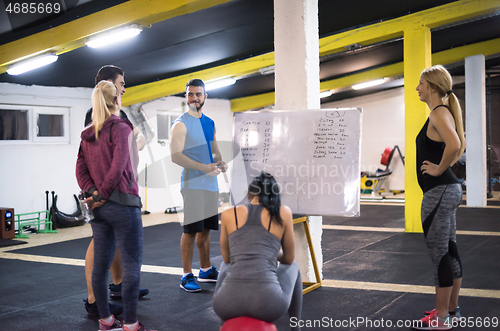 Image of athletes getting instructions from trainer