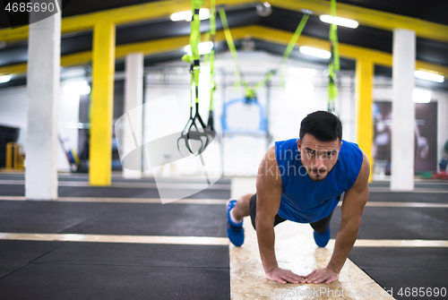 Image of Young  man doing pushups