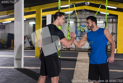 Image of young men making high five