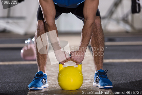 Image of man exercise with fitness kettlebell