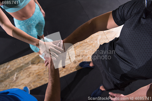 Image of young athletes making high five