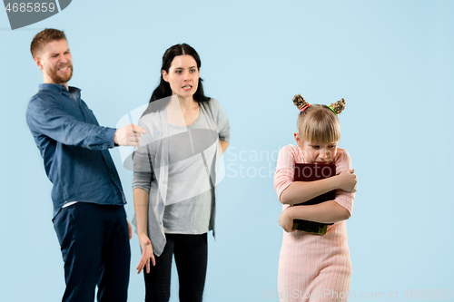 Image of Angry parents scolding their daughter at home