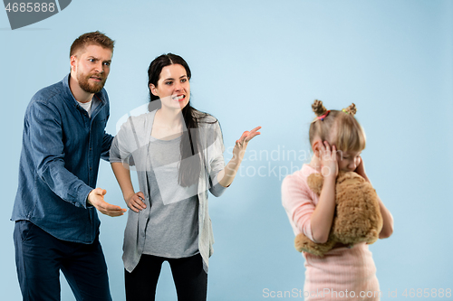 Image of Angry parents scolding their daughter at home