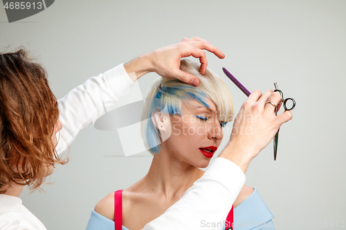 Image of Picture showing adult woman at the hair salon