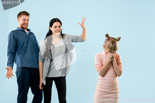 Image of Angry parents scolding their daughter at home