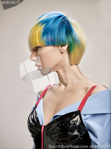 Image of Close-up indoor portrait of lovely girl with blonde hair. Studio shot of graceful young woman with short haircut