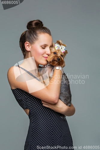 Image of Girl with yorkie dog