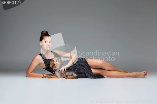 Image of Girl with yorkie dog