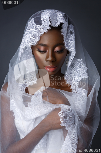 Image of Beautiful african girl with veil hat