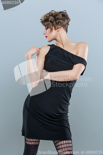 Image of girl in small black dress