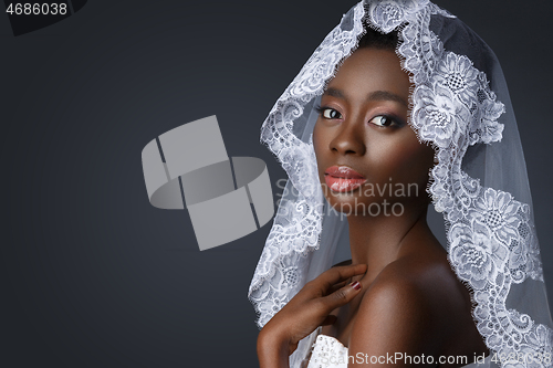 Image of Beautiful african girl with veil hat