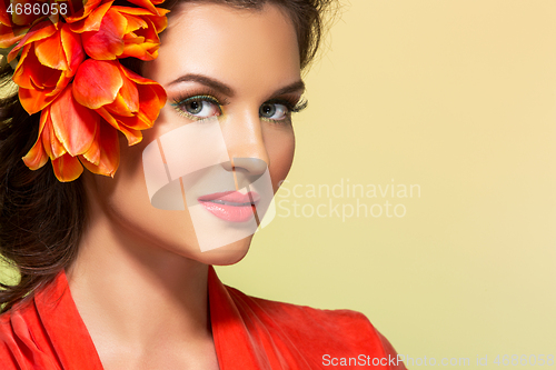 Image of beautiful girl in orange dress