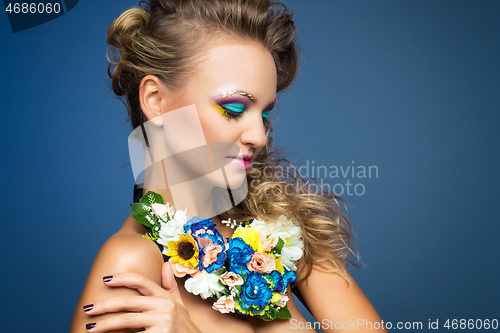 Image of beautiful girl with flower accessories