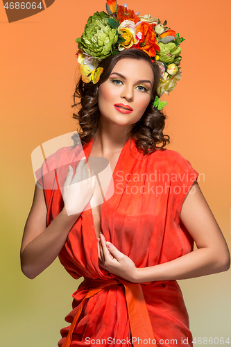 Image of beautiful girl in orange dress