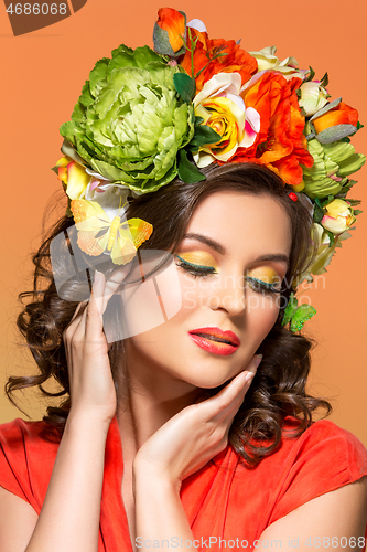 Image of beautiful girl in orange dress