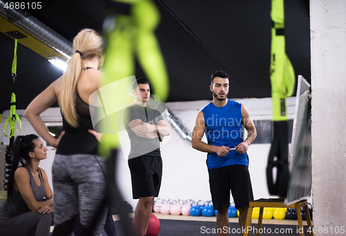 Image of athletes getting instructions from trainer