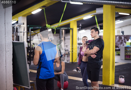 Image of athletes getting instructions from trainer