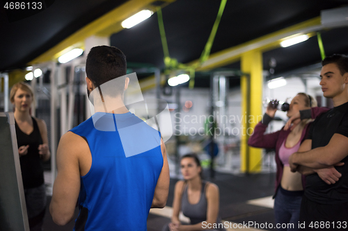 Image of athletes getting instructions from trainer