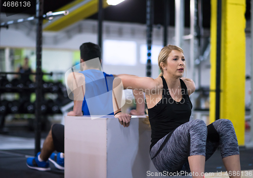 Image of athletes working out their arms