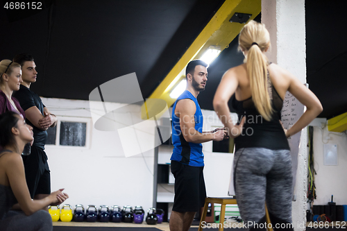 Image of athletes getting instructions from trainer