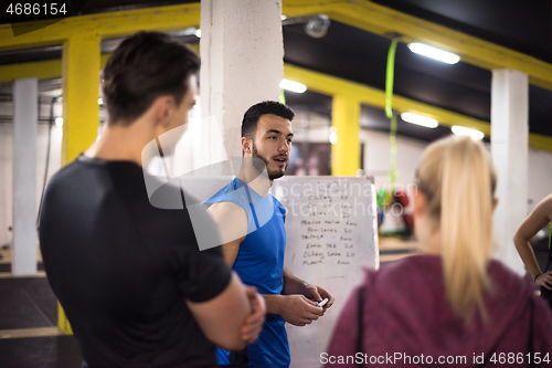 Image of athletes getting instructions from trainer