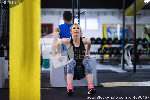 Image of athletes working out their arms