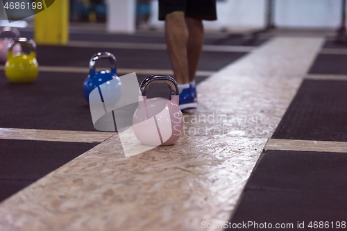 Image of athletes doing exercises with kettlebells