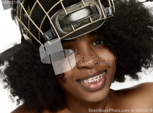 Image of Female hockey player close up helmet and mask