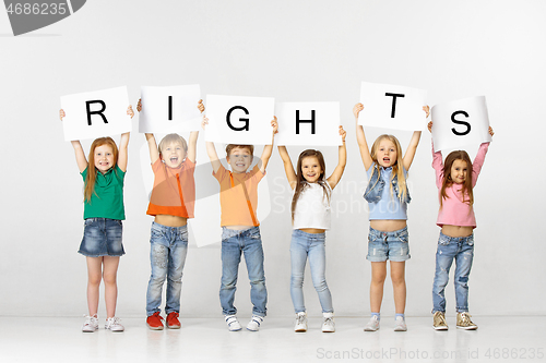 Image of Rights. Group of children with a banners isolated in white