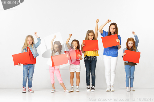 Image of Group of children with red banners isolated in white