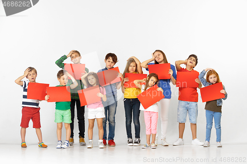 Image of Group of children with red banners isolated in white