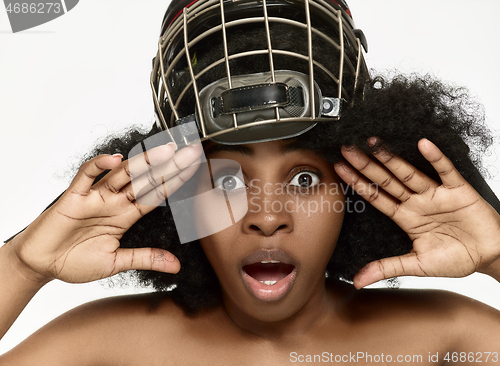 Image of Female hockey player close up helmet and mask