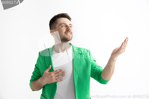 Image of Young dreaming man isolated on white background looking at something