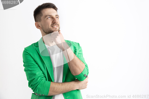 Image of Young dreaming man isolated on white background looking at something