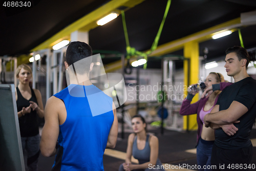 Image of athletes getting instructions from trainer