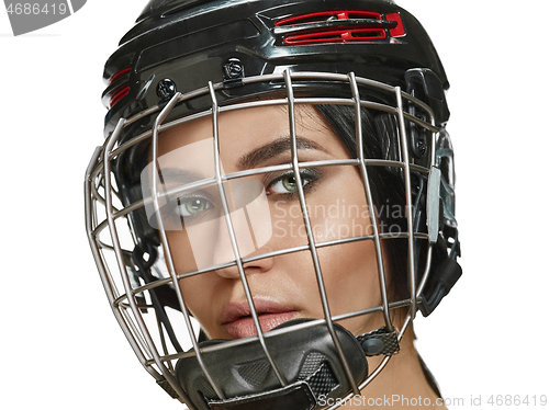 Image of Female hockey player close up helmet and mask
